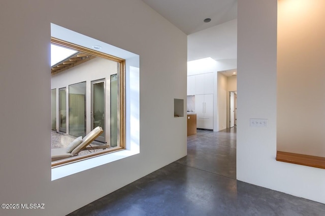 corridor with concrete floors
