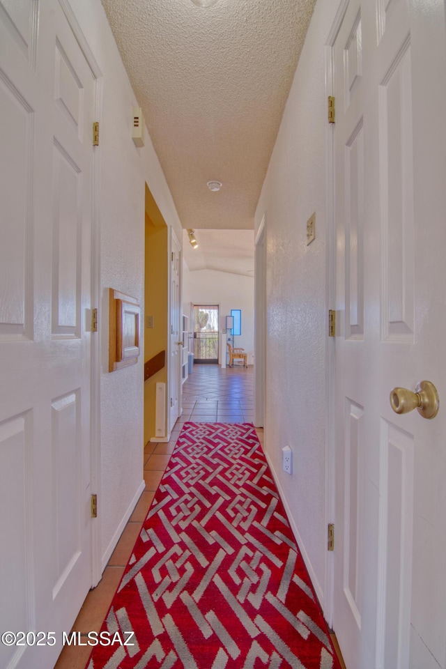 4050 S Melpomene Way, Tucson, AZ 85730 - corridor featuring a textured ceiling and tile patterned floors