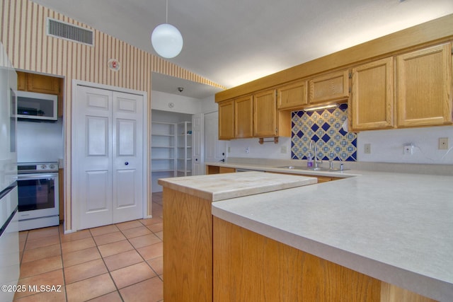 4050 S Melpomene Way, Tucson, AZ 85730 - kitchen featuring light tile patterned flooring, wall oven, white microwave, light countertops, and a sink
