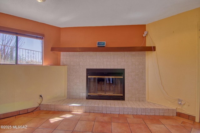 4050 S Melpomene Way, Tucson, AZ 85730 - room details with baseboards and a glass covered fireplace