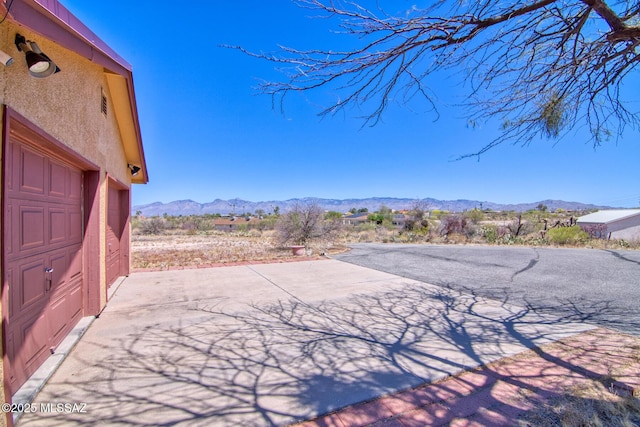 4050 S Melpomene Way, Tucson, AZ 85730 - view of yard with a mountain view and a patio area