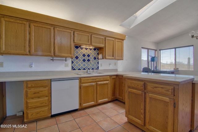 4050 S Melpomene Way, Tucson, AZ 85730 - kitchen featuring white dishwasher, a sink, vaulted ceiling with skylight, light countertops, and a peninsula