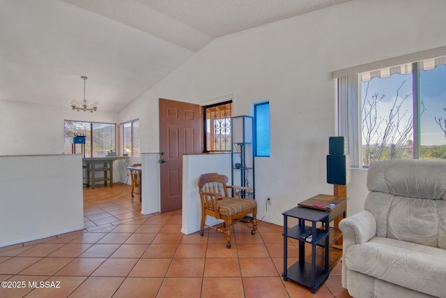 4050 S Melpomene Way, Tucson, AZ 85730 - living area featuring light tile patterned flooring, an inviting chandelier, and vaulted ceiling