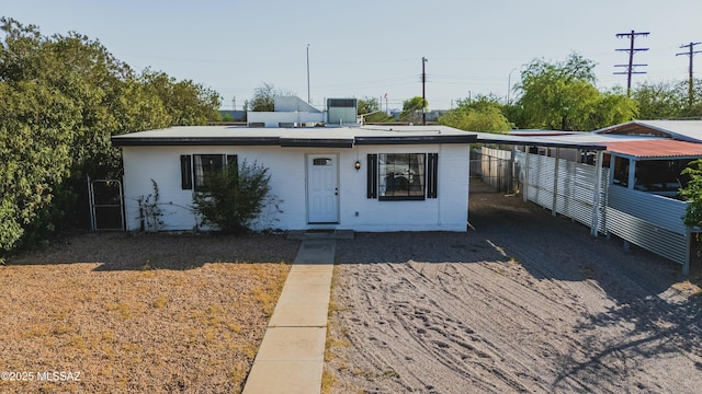 view of front of property with central air condition unit and fence