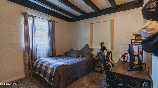 bedroom with carpet floors, brick wall, and beamed ceiling