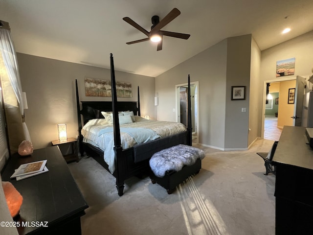 bedroom featuring baseboards, ceiling fan, vaulted ceiling, and light carpet