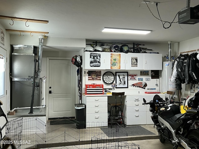 garage with heating unit and a garage door opener