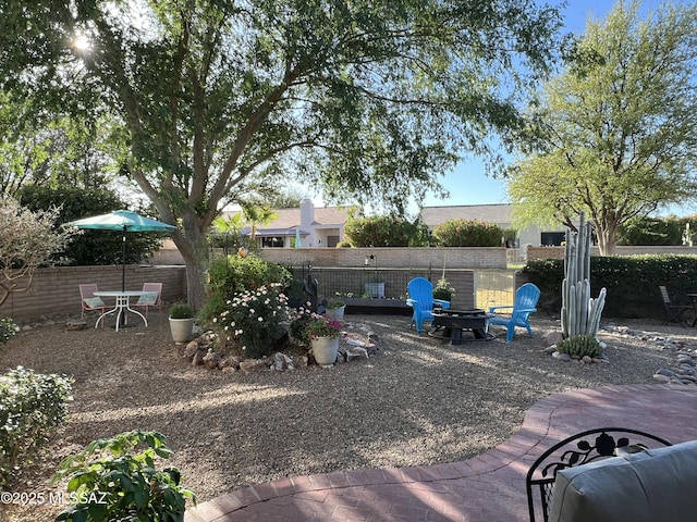 view of yard featuring a fenced backyard and a patio