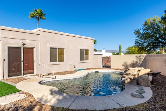 view of swimming pool featuring a fenced backyard and a fenced in pool