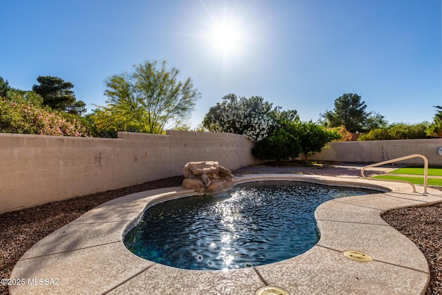 view of swimming pool with a fenced in pool and a fenced backyard