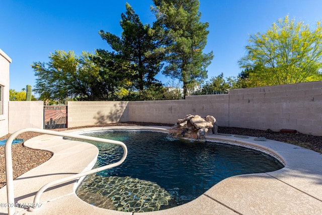 view of swimming pool with a fenced in pool and a fenced backyard
