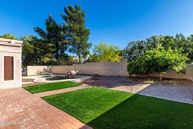 view of yard with a fenced backyard and a patio area