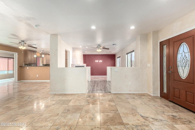 entryway with recessed lighting, a ceiling fan, and baseboards