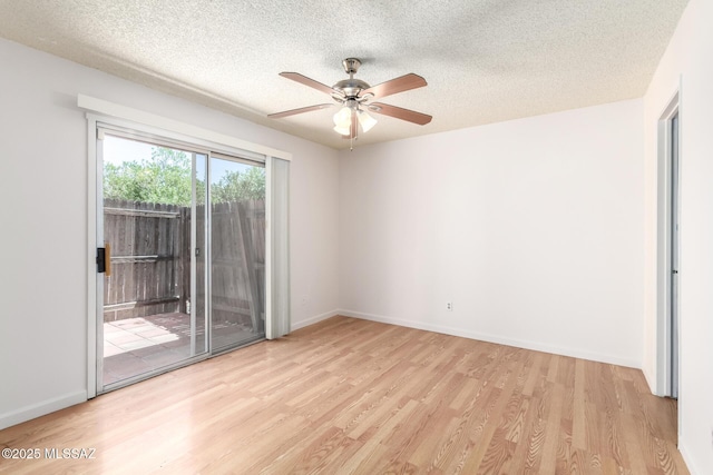 unfurnished room with baseboards, a textured ceiling, ceiling fan, and wood finished floors