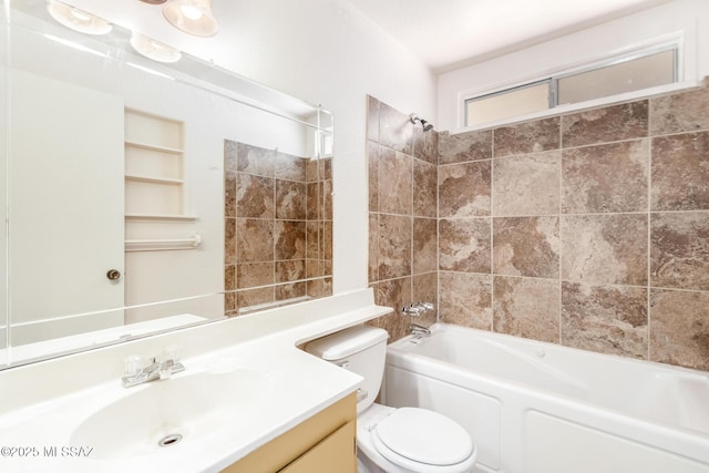 bathroom featuring vanity, shower / bathtub combination, and toilet