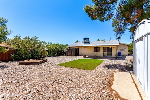 back of property with a patio and fence