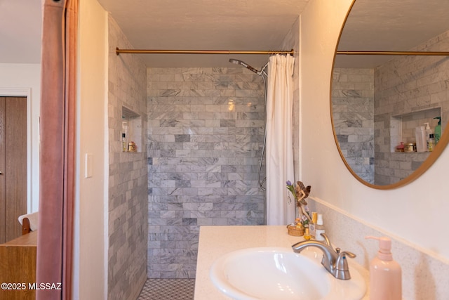 7302 E Placita Sinaloa, Tucson, AZ 85710 - bathroom featuring a tile shower and vanity
