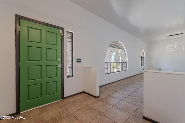 tiled entrance foyer with baseboards