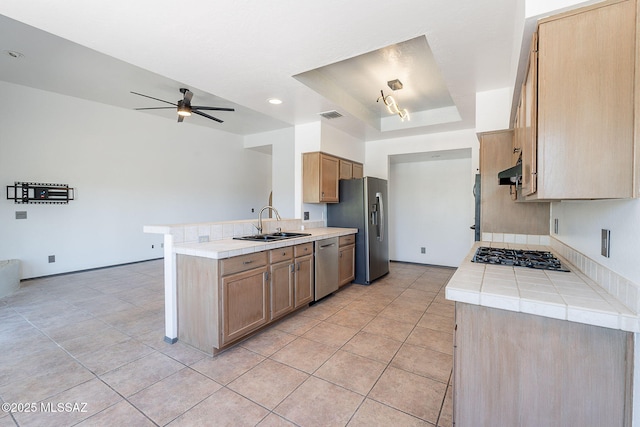 kitchen with light tile patterned floors, visible vents, appliances with stainless steel finishes, and a sink