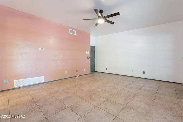 unfurnished room featuring ceiling fan, light tile patterned flooring, baseboards, and visible vents