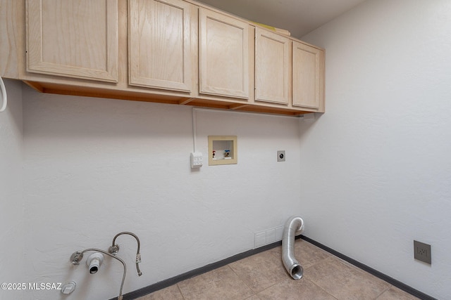 clothes washing area featuring cabinet space, hookup for an electric dryer, hookup for a gas dryer, baseboards, and hookup for a washing machine