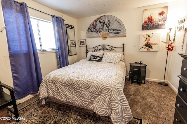 carpeted bedroom with baseboards