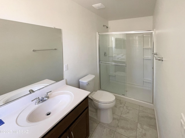 bathroom featuring vanity, a shower stall, toilet, and marble finish floor