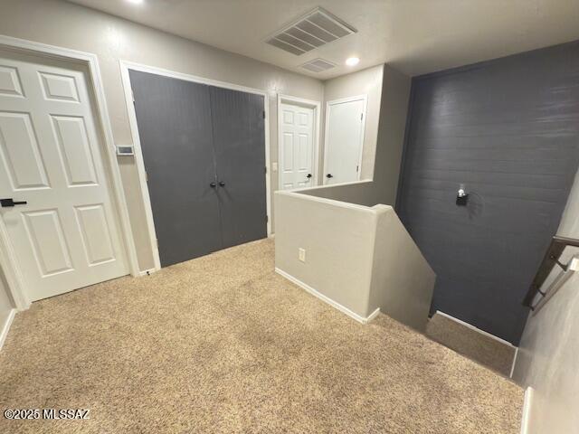 hall with recessed lighting, visible vents, and carpet