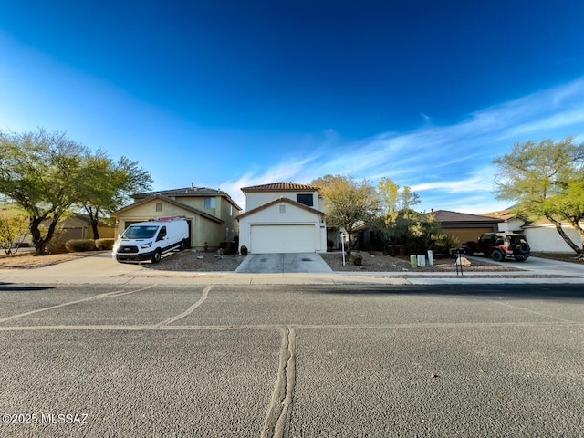 view of front of house featuring a garage and driveway
