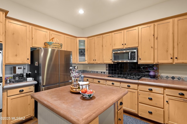6300 N Abington Rd, Tucson, AZ 85743 - kitchen featuring appliances with stainless steel finishes, light brown cabinets, glass insert cabinets, recessed lighting, and a kitchen island