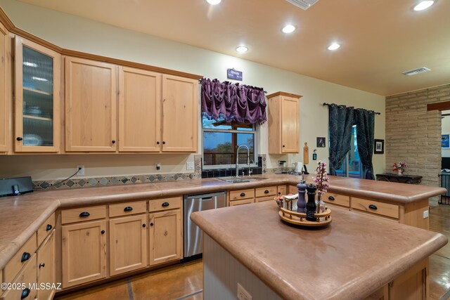 6300 N Abington Rd, Tucson, AZ 85743 - kitchen with light brown cabinets, stainless steel dishwasher, a sink, a peninsula, and light countertops