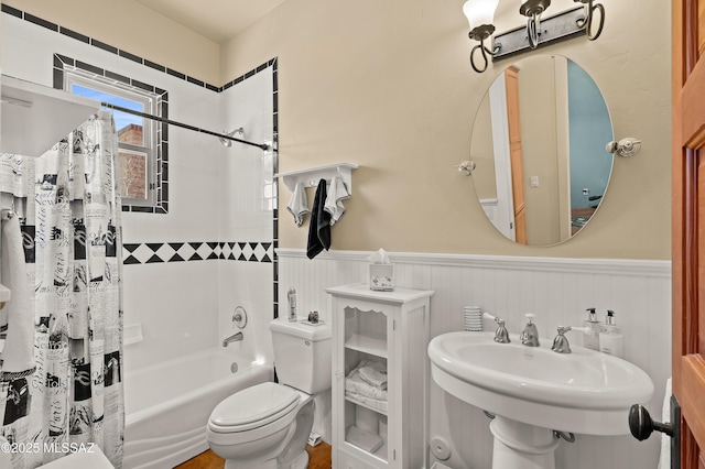 6300 N Abington Rd, Tucson, AZ 85743 - bathroom featuring wainscoting, shower / bath combo, toilet, and a sink