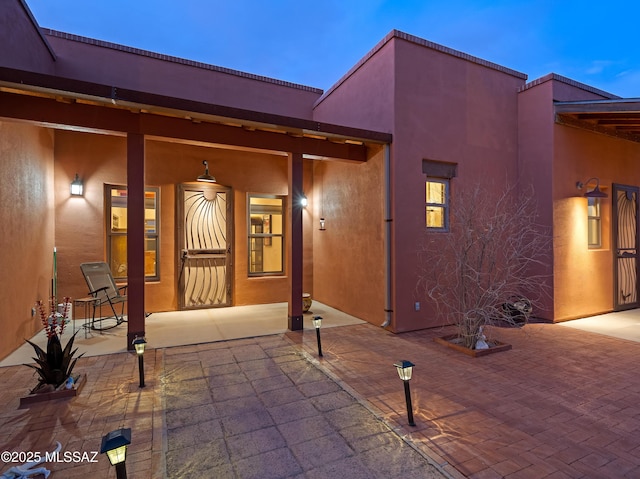 6300 N Abington Rd, Tucson, AZ 85743 - view of exterior entry featuring stucco siding and covered porch