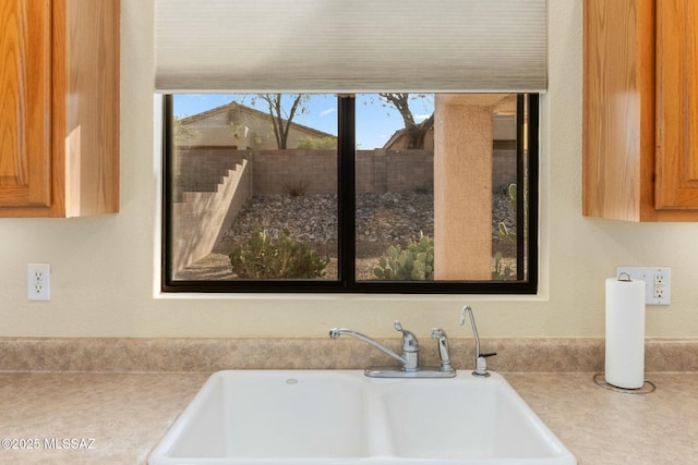 details with a sink and light countertops
