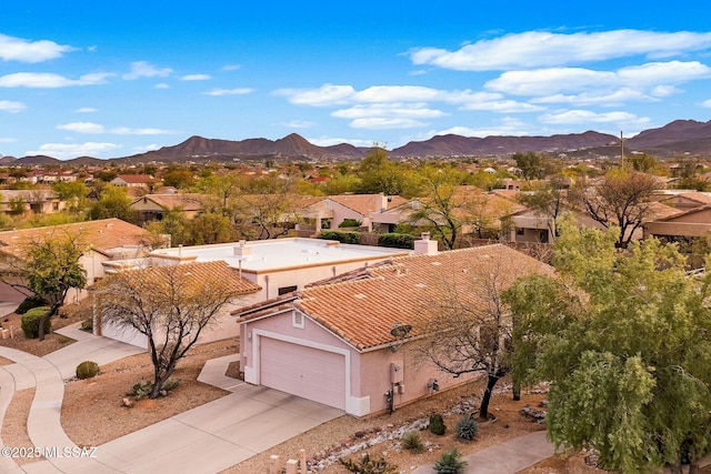 aerial view featuring a mountain view and a residential view