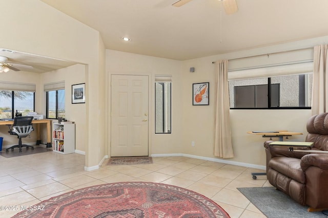 living room with a ceiling fan, baseboards, recessed lighting, and light tile patterned flooring