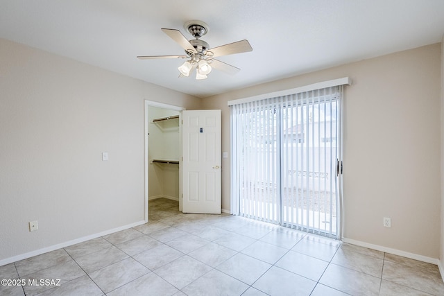 7848 E 35th St, Tucson, AZ 85710 - unfurnished room with a ceiling fan, baseboards, and light tile patterned floors