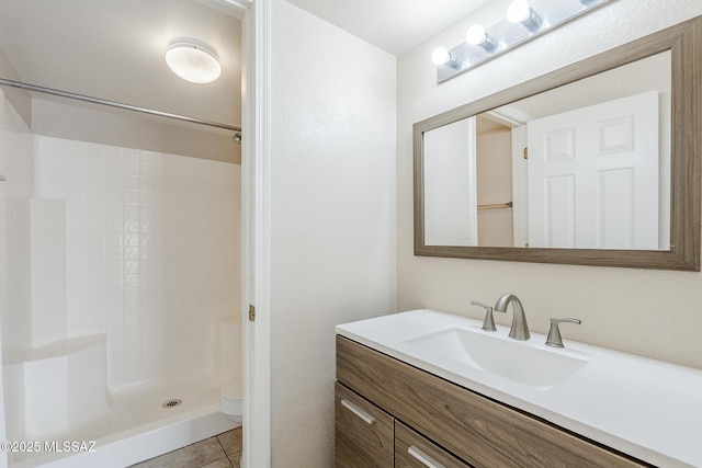 7848 E 35th St, Tucson, AZ 85710 - full bath featuring vanity, a shower, toilet, and tile patterned flooring