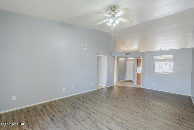 7848 E 35th St, Tucson, AZ 85710 - spare room with vaulted ceiling, ceiling fan, wood finished floors, and baseboards