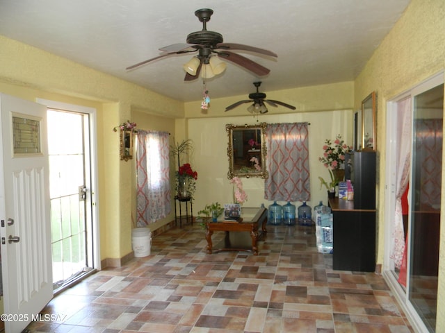 interior space featuring a ceiling fan