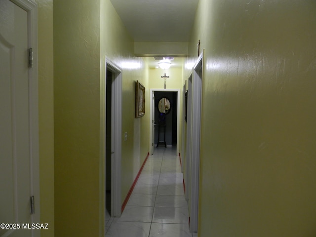 hall with light tile patterned flooring