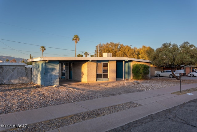 8133 E 6th St, Tucson, AZ 85710 - mid-century inspired home with a chimney and fence
