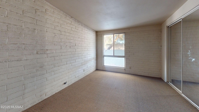 8133 E 6th St, Tucson, AZ 85710 - unfurnished bedroom featuring carpet flooring and a closet
