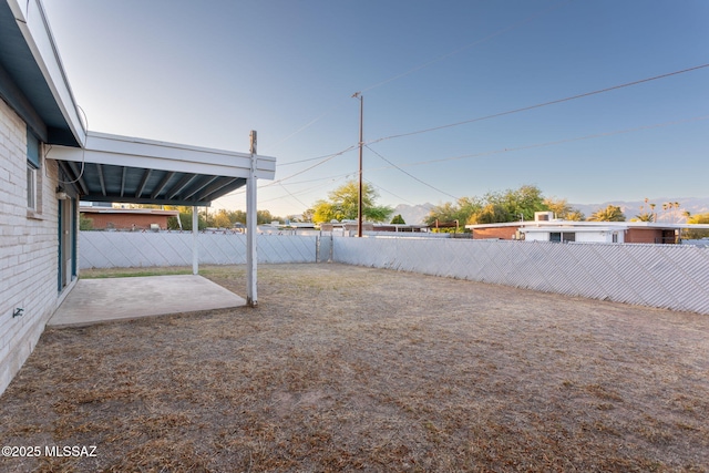8133 E 6th St, Tucson, AZ 85710 - fenced backyard featuring a patio