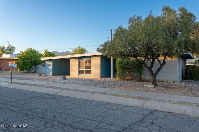 8133 E 6th St, Tucson, AZ 85710 - view of front of property featuring brick siding