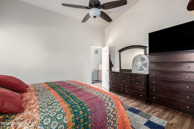 bedroom featuring a ceiling fan, high vaulted ceiling, and wood finished floors