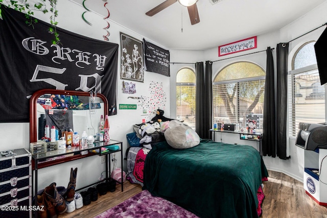 bedroom featuring ceiling fan and wood finished floors