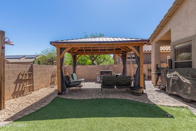 view of yard featuring a gazebo, a fenced backyard, and a patio