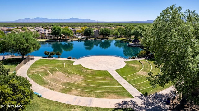 birds eye view of property featuring a water and mountain view