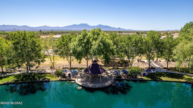 birds eye view of property featuring a water and mountain view
